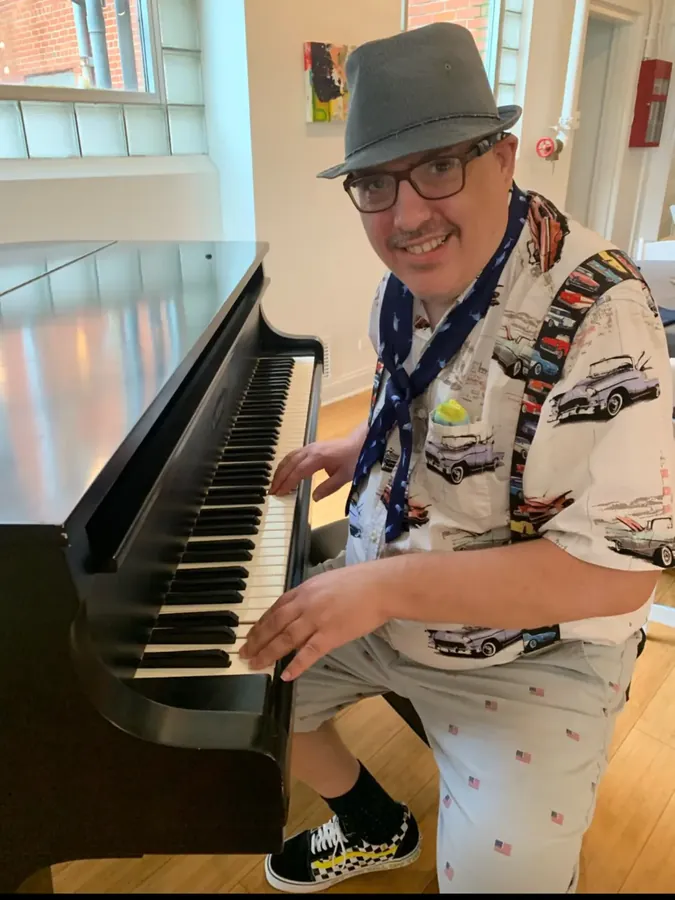 Participant playing piano indoors
